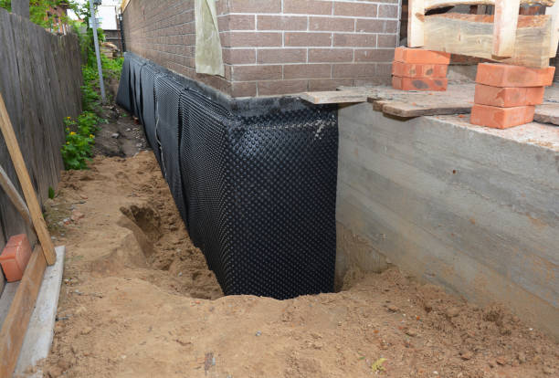 SJ Waterproofing Pros technician performing targeted Interior Drainage System assessment in Villanova, PA